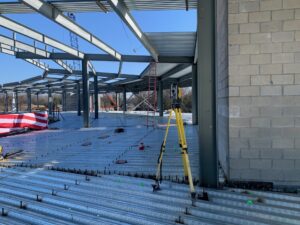 Trimble robotic total station set up on an active construction deck